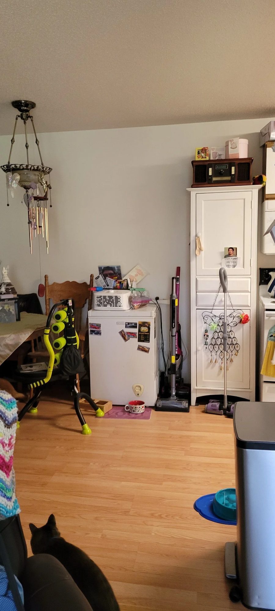 After: the same kitchen corner cleared, with open floor and the cabinet reachable again